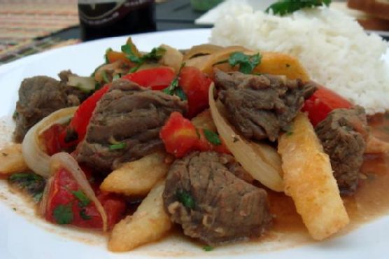 Peruvian Lomo Saltado with Crispy Quinoa Crust and Citrus Avocado Salsa recipe by Meaghan Moineau
