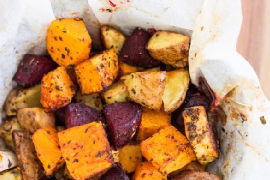 Spicy Maple-Roasted Autumn Vegetables with Herbed Goat Cheese Drizzle recipe by Meaghan Moineau