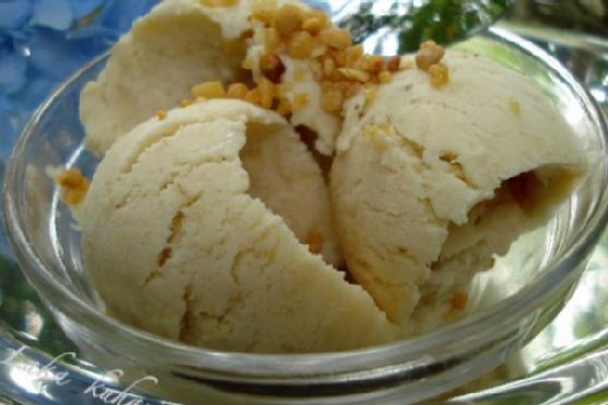 Caramelized Banana Rum Ice Cream with Toasted Coconut and Spiced Maple Drizzle recipe by Meaghan Moineau