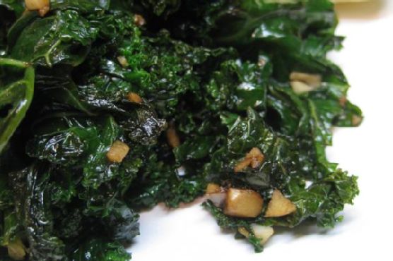 Garlicky Kale with Toasted Pine Nuts and Sun-Dried Tomatoes recipe by Meaghan Moineau