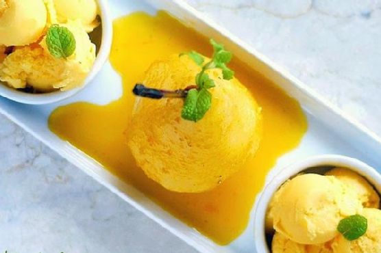 Exotic Cardamom-Poached Pears with Spicy Mango-Nectar Reduction and Pistachio Crumble | Made by Meaghan Moineau