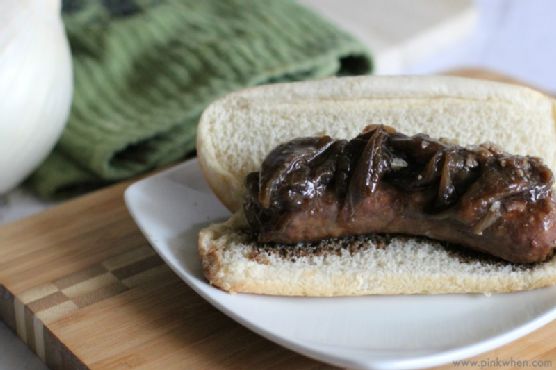 Guinness-Infused Brats with Caramelized Onion Jam and Pretzel Buns recipe by Meaghan Moineau